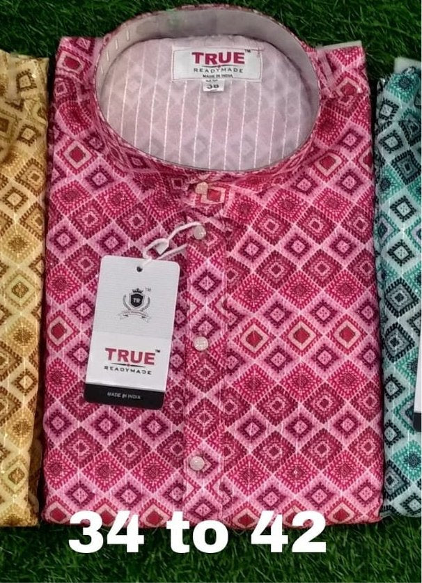 Folded rani pink kurta with a contrasting geometric pattern across the front.