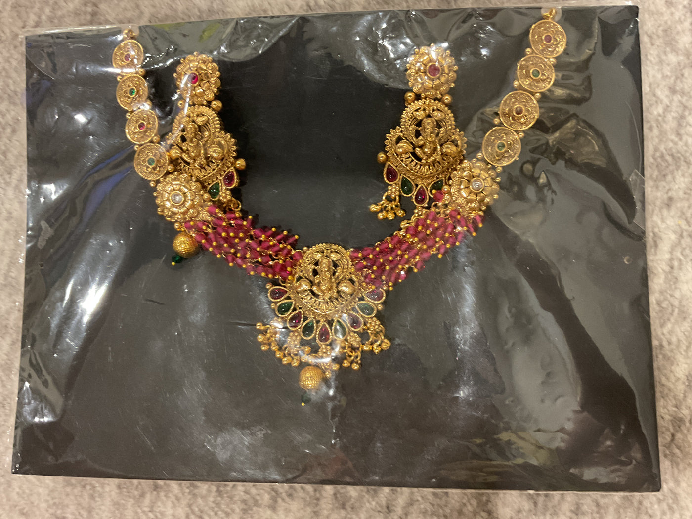 Kundan Temple Necklace – Lakshmi Motif, Ruby Bead Chain & Gold Drops