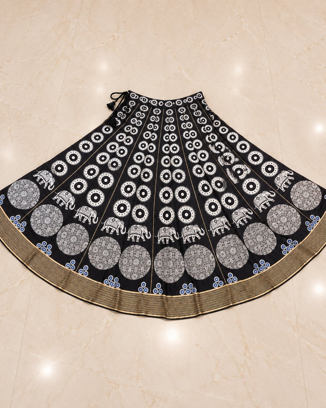Black chaniya choli skirt with elephant and medallion print, gold zari border