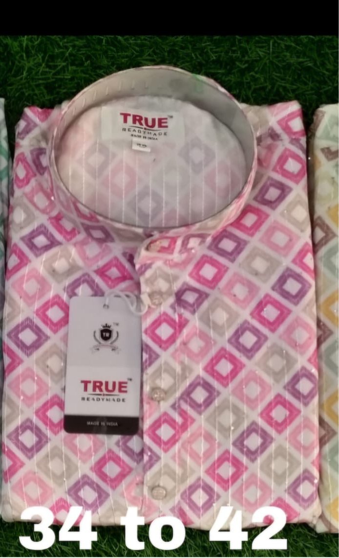 Folded kurta with pink, purple and taupe geometric motifs on a light-colored ground.