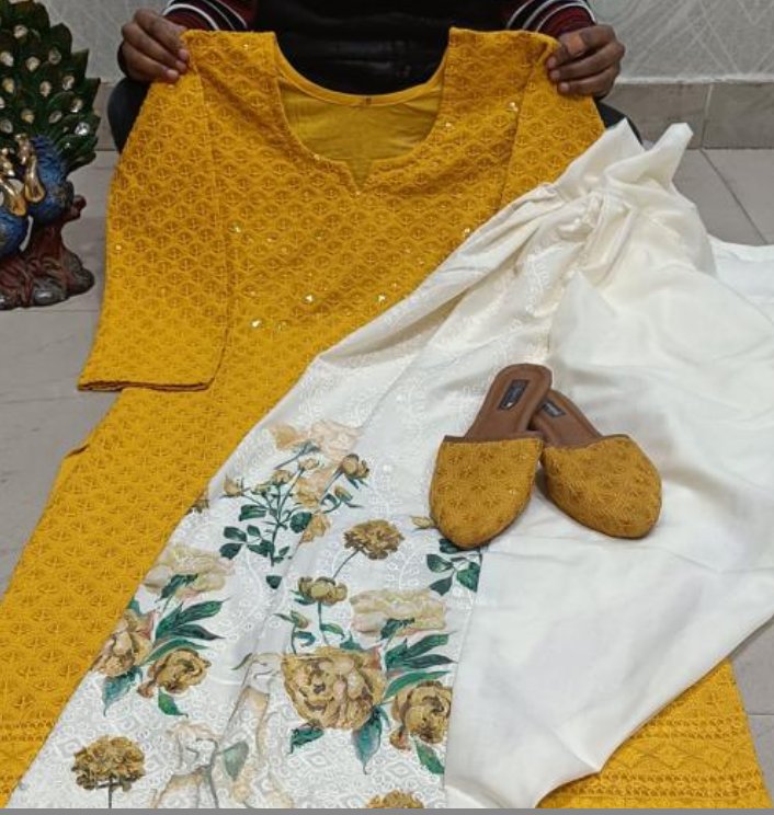 Golden Phulkari embroidered kurti with a cream floral-print bottom