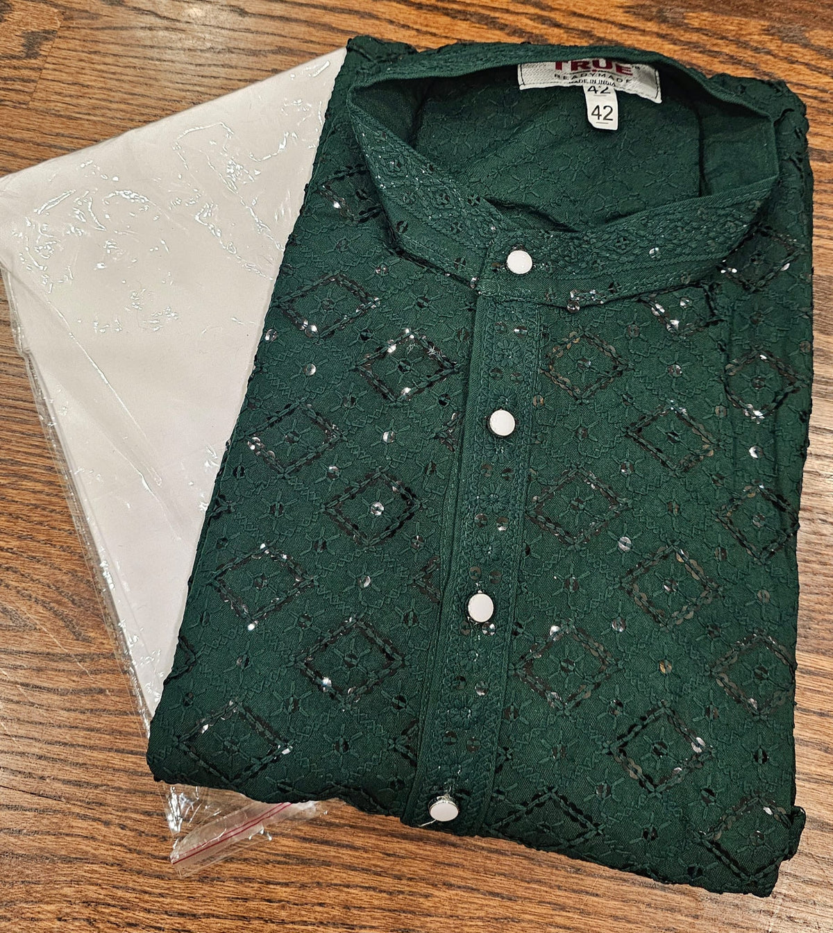 Dark bottle-green kurta with diamond-lattice sequin embroidery, mandarin collar and white buttons