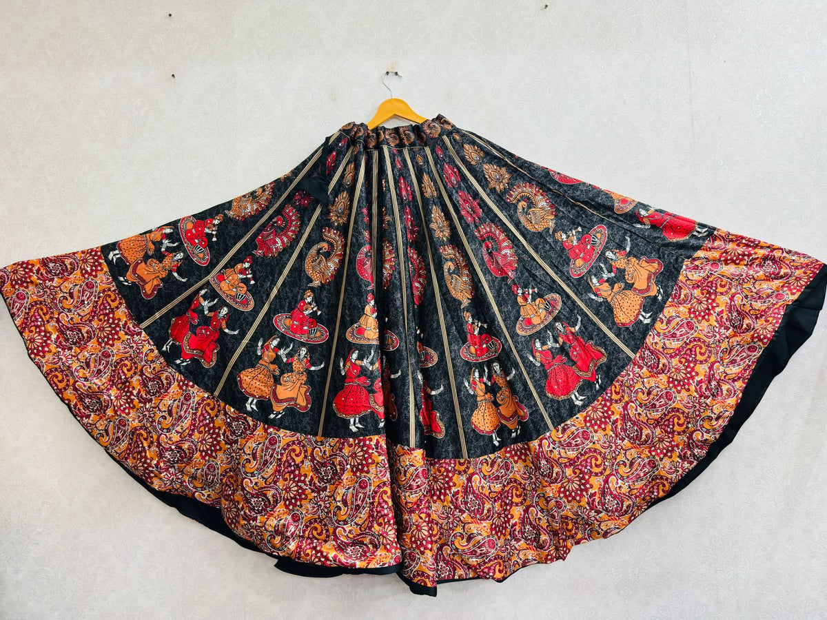 Black colorway Chaniya skirt laid flat showing illustrated folk dancer figures
