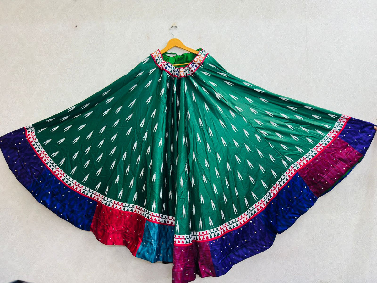Emerald green chaniya choli skirt, ikat print with mirror work border