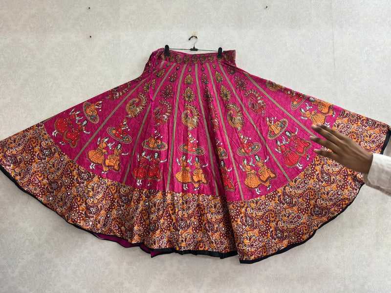 Magenta chaniya choli skirt with folk dancer print and paisley border