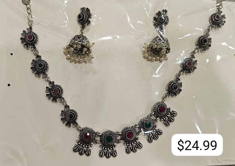 Maroon-and-green necklace with silver-tone round floral links and matching bell-shaped earrings with off-white beads.