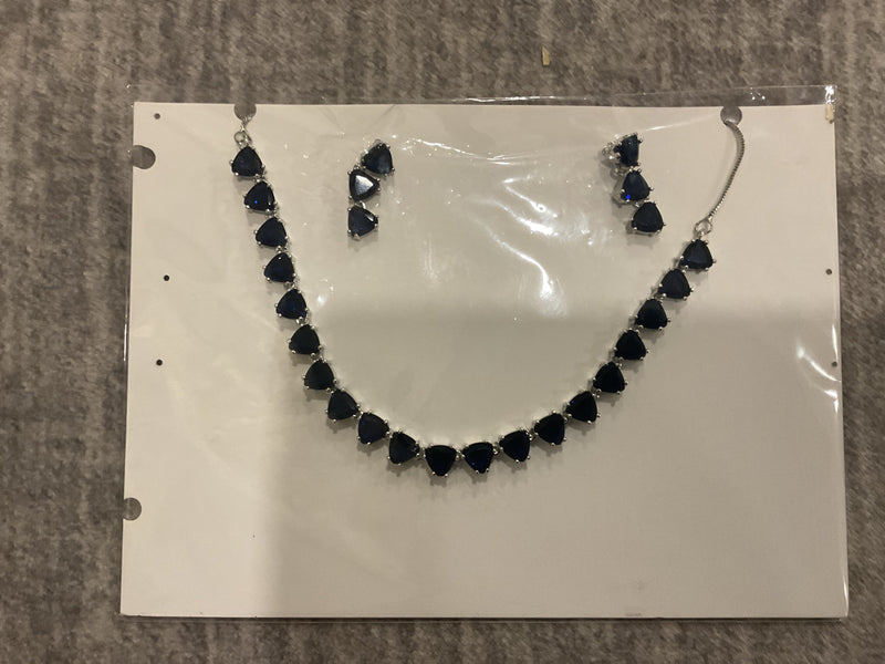 Navy-blue necklace with linked rounded triangular accents, silver-tone connectors and matching photographed drop earrings.