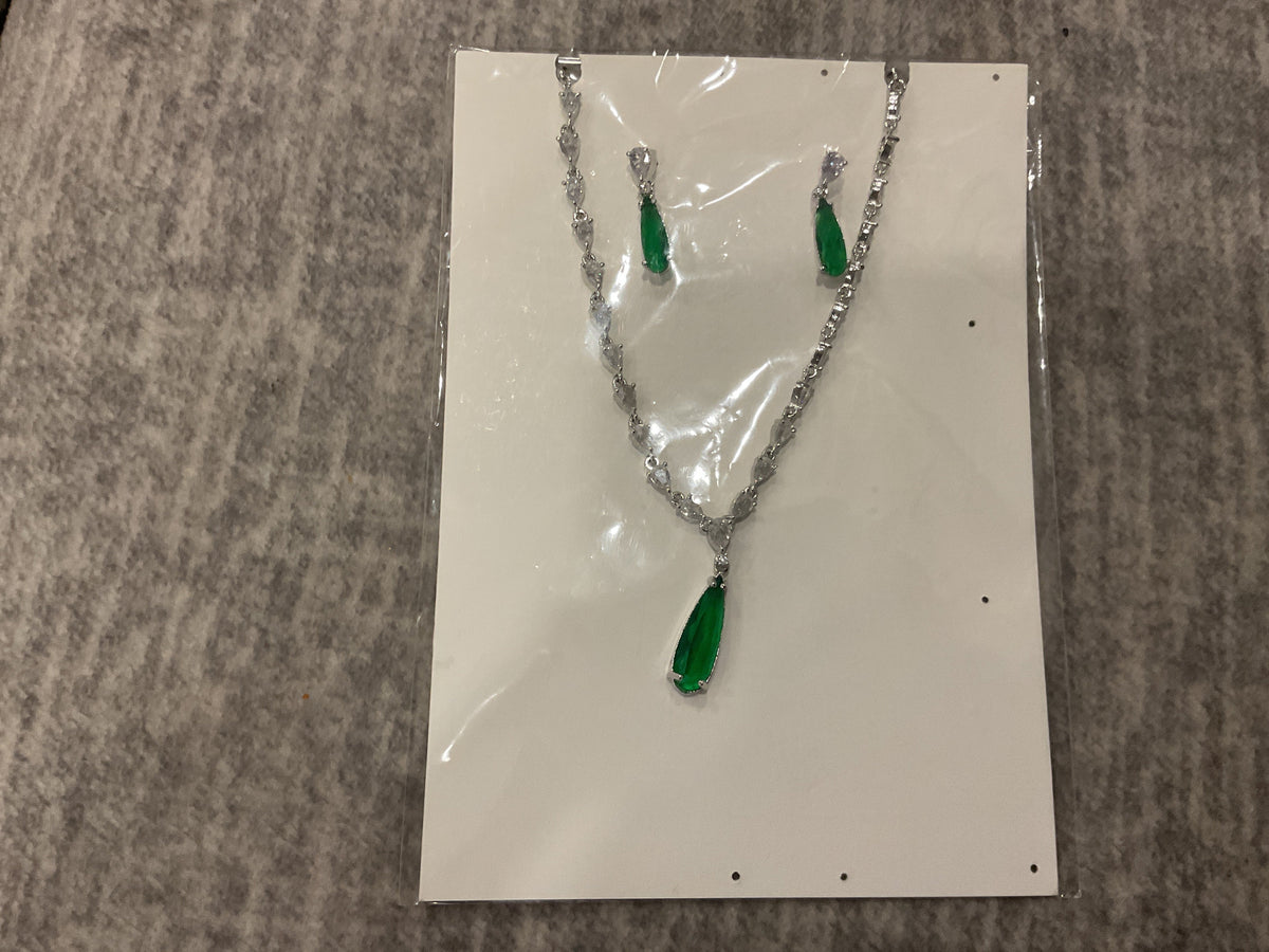 Green elongated teardrop pendant necklace with silver-tone links, clear accents and matching photographed drop earrings.