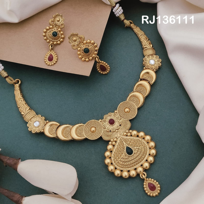 Antique gold-tone necklace with alternating circular and crescent-shaped links with a beaded teardrop pendant, shown with coordinating drop earrings.